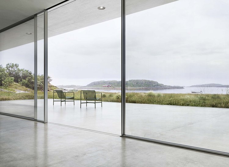 Minimal sliding windows and doors - sleek, contemporary design, seamlessly connecting indoor and outdoor spaces.