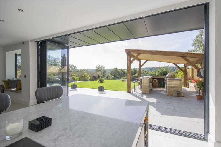 Bifold doors - versatile and space-efficient, folding neatly to create a seamless indoor-outdoor connection.