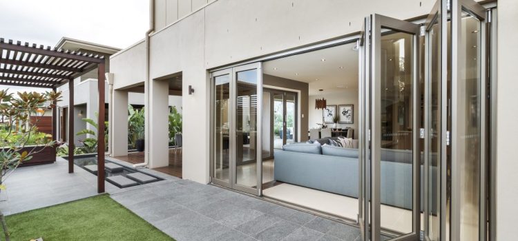 Bifold doors, folding panels creating a wide opening for indoor-outdoor transition.